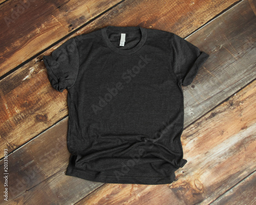 Mockup of blank gray tshirt on rustic wood background