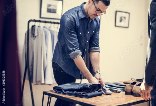 Man working in retail cloth shop