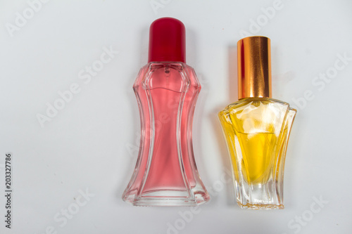 Bottle of perfume isolated on white background. top view.