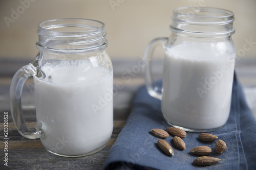 Jars of Almond Milk with Raw Almonds