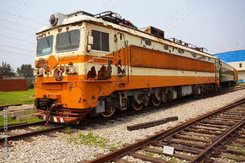 Old out of date rust yellow train locomotive