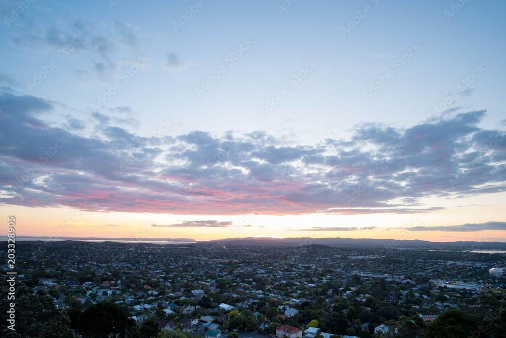 Beautiful View of a town in Auckland, New Zealand. Cloud sunset and town, View from Mt. Eden.