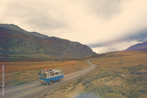 Old german vintage campervan beautiful landscape near Paso Roballos, retro vintage photo filter effect in pastell colers with light leaks and increased exposure, Argentina and Chile, South America © reisegraf