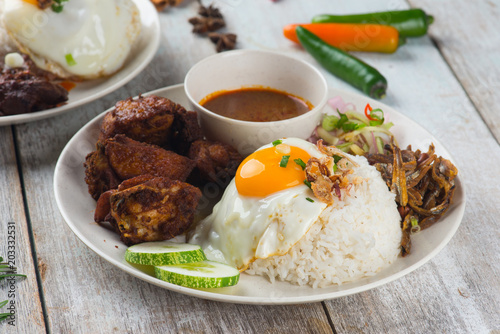 malaysian fried chicken rice with anchovies and egg