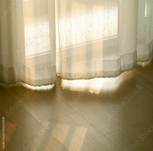Light the morning through the curtains.