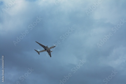transport airplane in the cloudy sky, bottom view © Glebovic