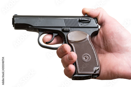 Pistol in the hands of a man isolated
