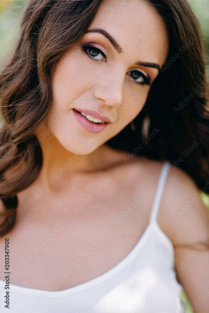 Bride's morning in the garden. Fine art wedding. Portrait of a young beautiful sexy tender bride with red lips in white lace dress. Closeup view Bride's morning in the garden. Fine art wedding. Portrait of a young beautiful sexy tender bride with red lips in white lace dress. Closeup view