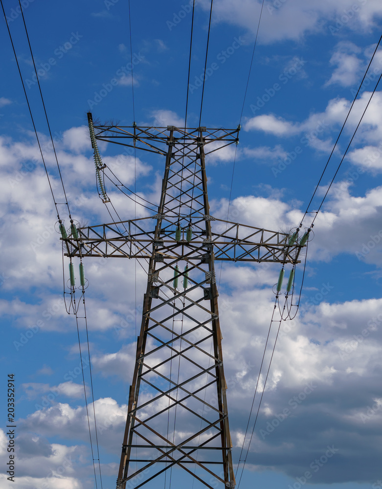 Electricity Pylon - standard overhead power line transmission tower at sunset. Electricity Pylon - standard overhead power line transmission tower at sunset.