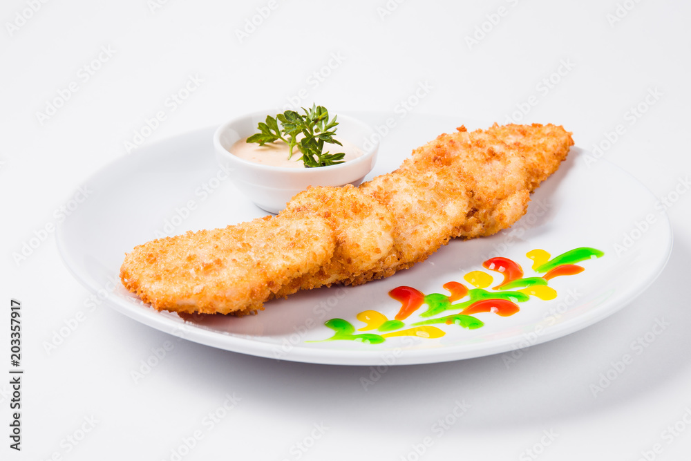 Chicken cutlet on a round white plate Chicken cutlet on a round white plate