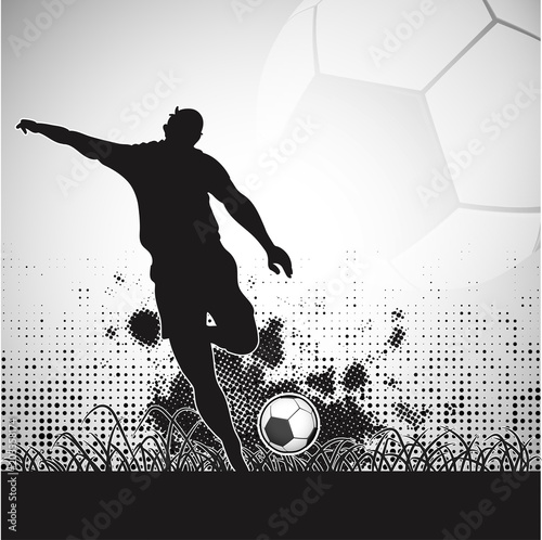 Silhouette of a football players at the time of kicking ball on halftone background.