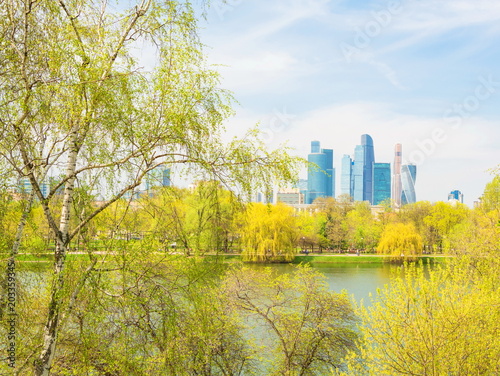 Moscow spring city landscape with lake and skyscrapers