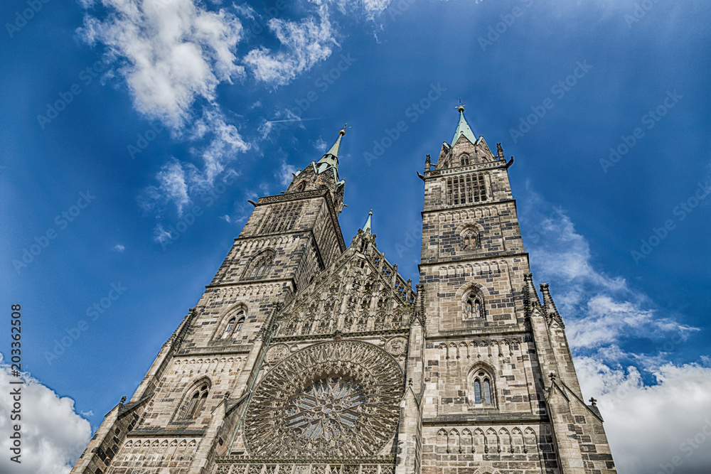 Fototapeta premium Saint Lawrence cathedral on the blue sky background. Medieval gothic church in Nuremberg, Germany