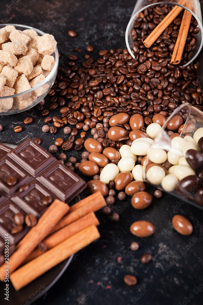 Yummy candies and sweets on a dark wooden board. Studio photo. Top view Yummy candies and sweets on a dark wooden board. Studio photo. Top view