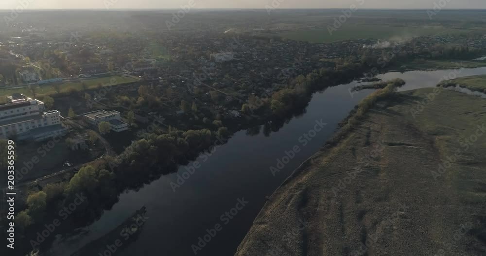 Summer landscape, view of nature from a height, river, countryside village aerial view.
Summer landscape, view of nature from a height, river, countryside village aerial view.