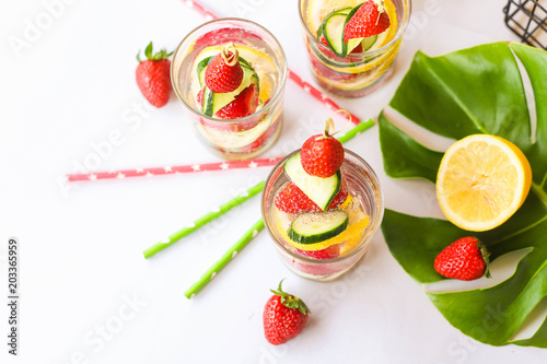 Traditional Pimms cocktail with lemonade, strawberries, cucumber, orange and mint