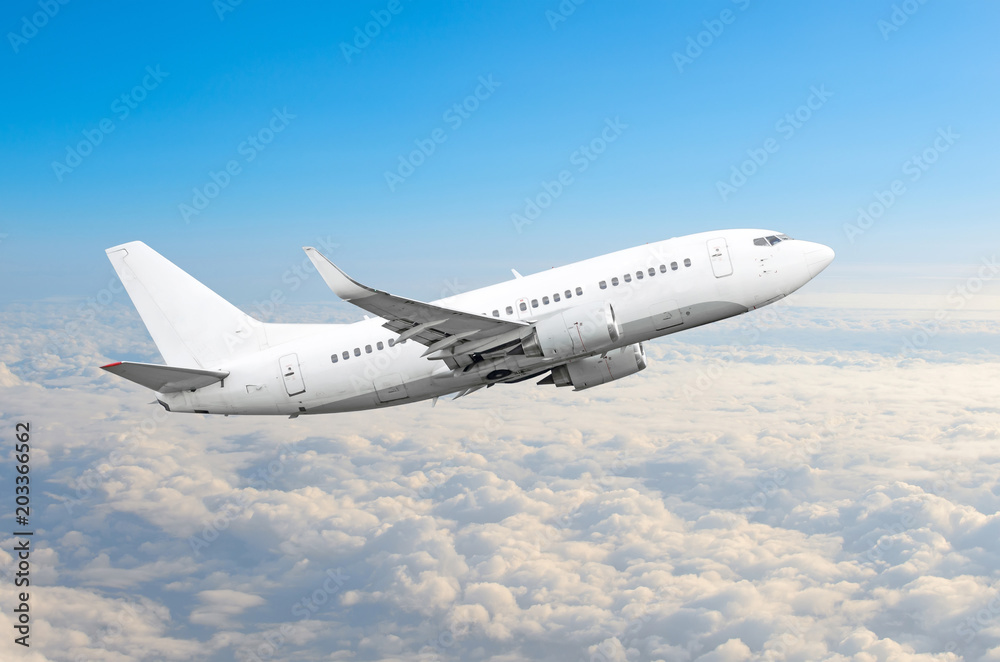 Passenger airplane fly on a hight above overcast clouds and blue sky. Passenger airplane fly on a hight above overcast clouds and blue sky.