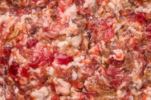 Fresh homemade raw chopped beef and pork meat. Minced meat texture, close up background - top view.