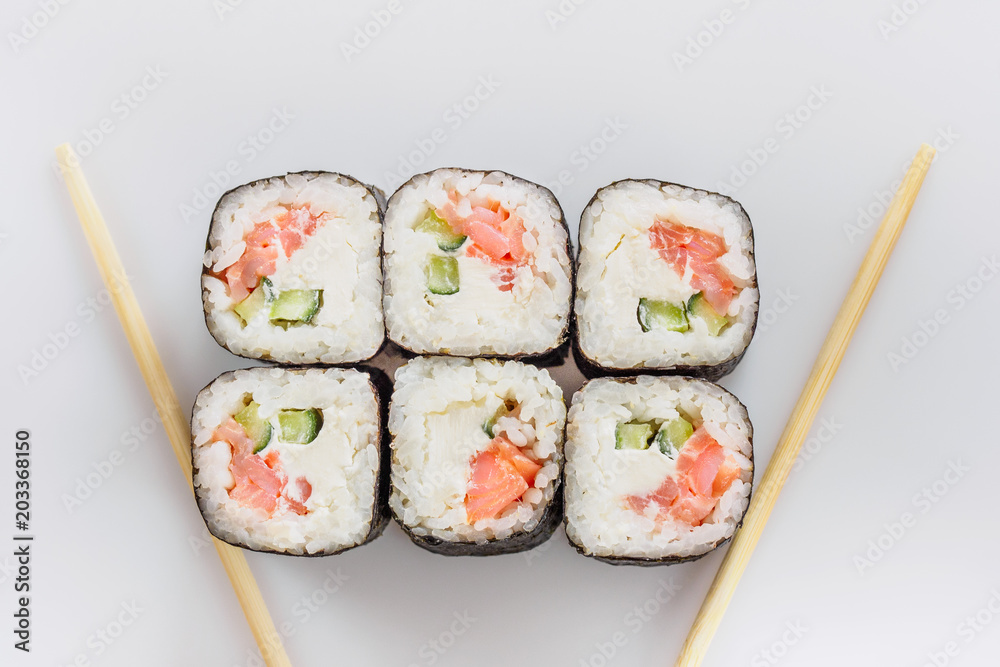 Traditional fresh japanese sushi rolls isolated on white background. Top view Traditional fresh japanese sushi rolls isolated on white background. Top view