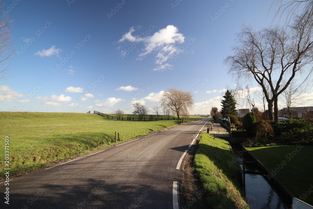 Fototapeta premium Wide angle view of polder Wilde Veenen at Donderdam between the villages of Moerkapelle and Waddinxveen in the Netherlands