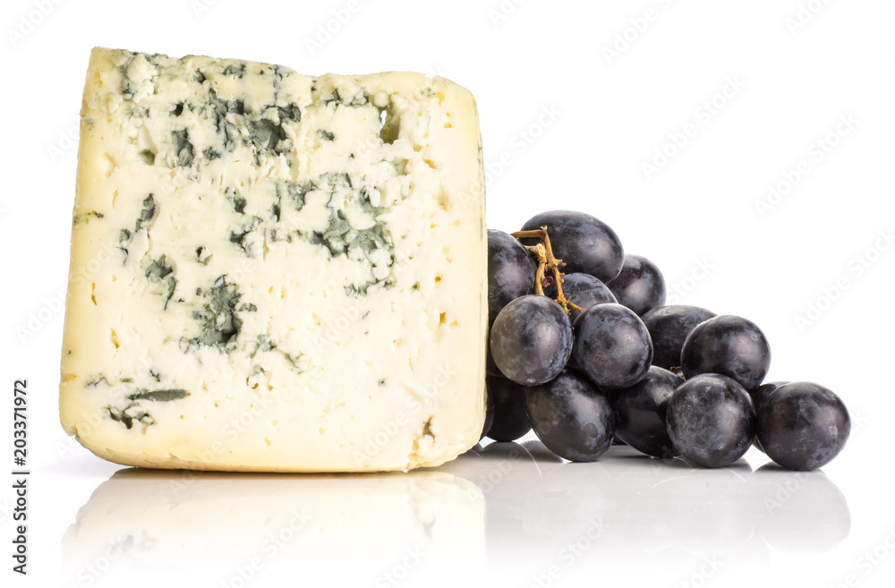 Black grape cluster (autumn royal variety) with a blue mold cheese isolated on white background.