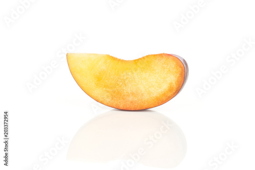 One red blue plum slice isolated on white background.