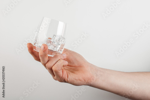 empty glass of wine in hand on a white background