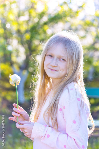girl with yellow tulip in hand © Sergii Mostovyi