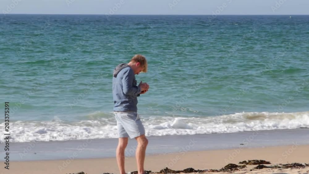 Foolish man ignores beauty of nature and uses phone Foolish man ignores beauty of nature and uses phone
