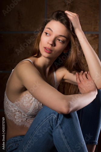 Test photo shoot for young sexy model wearing blue jeans and lace bra