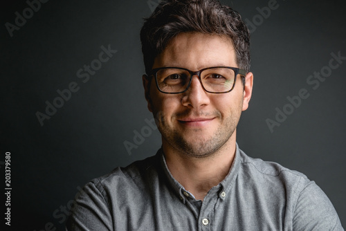 Smiling businessman with eyeglasses