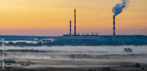 power plant for ecological fuels enveloped in morning fogs in Poland