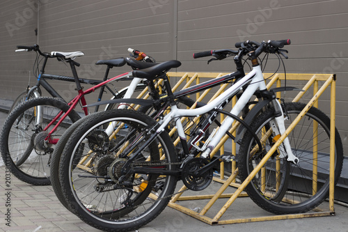 Bicycles stand in the parking lot, front view