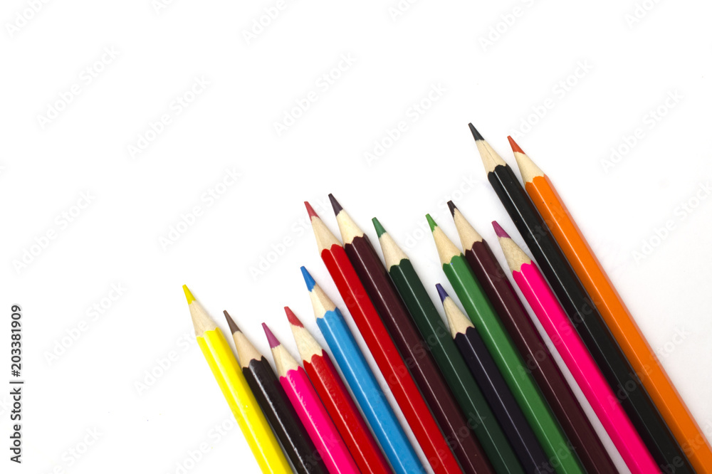set of colored pencils in a row isolated on white