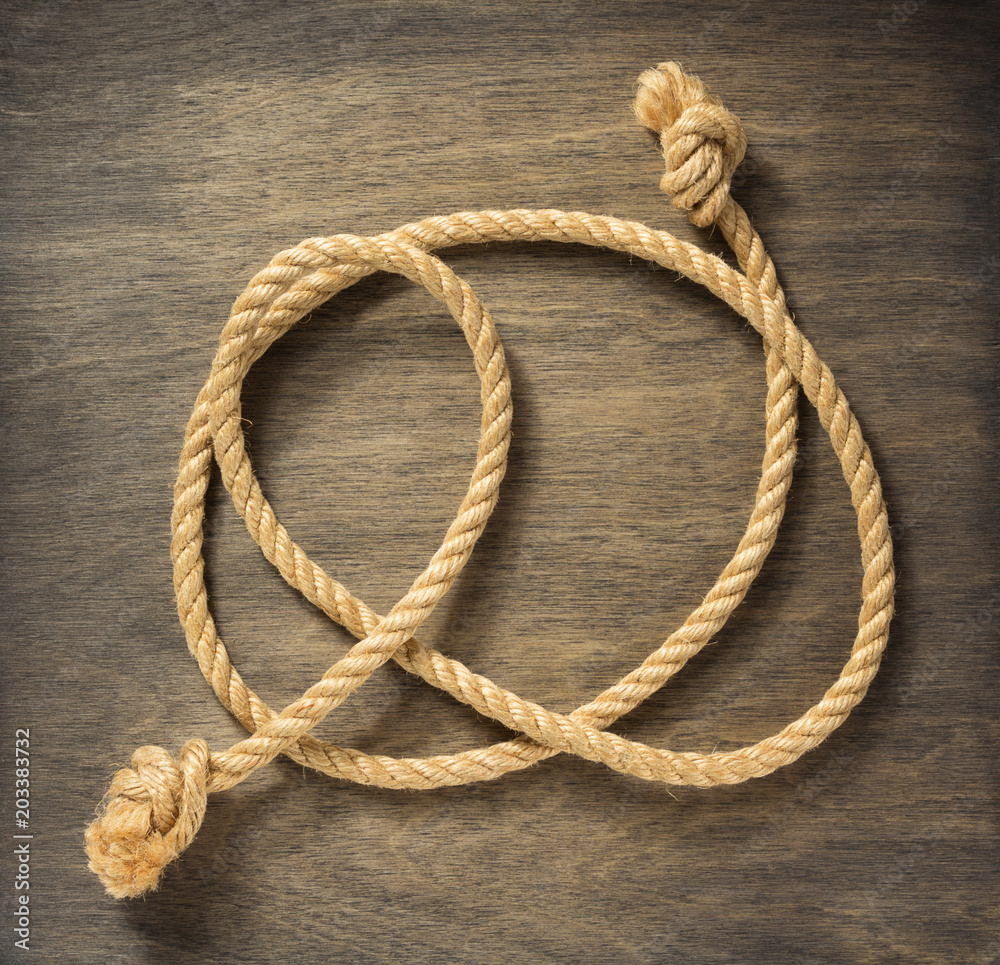 Obraz premium ship rope at wooden background
