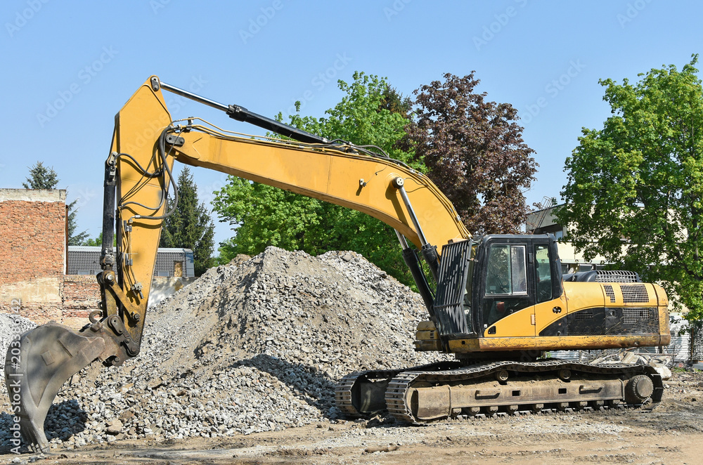 Excavator at the construction site Excavator at the construction site