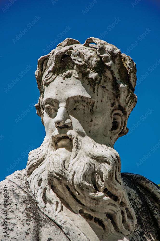 Close-up of a statue at the Gardens of the Fountain, in the city center of Nimes. Located in the Gard department, Occitanie region in southern France