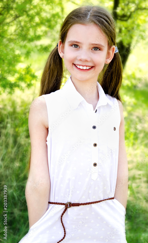 Portrait of adorable smiling little girl outdoors Portrait of adorable smiling little girl outdoors