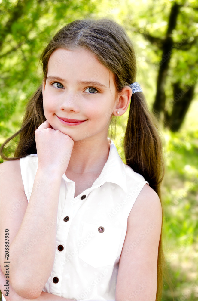 Portrait of adorable smiling little girl outdoors Portrait of adorable smiling little girl outdoors