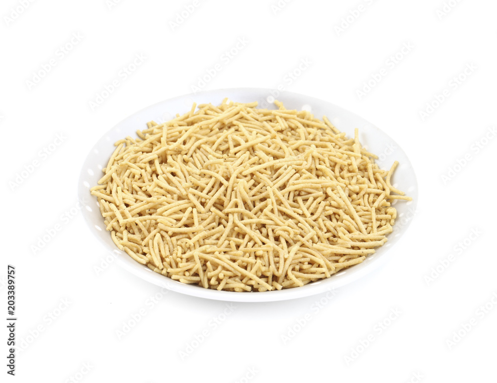 Indian Namkeen Food Aloo Sev also know as namkin and nimco a popular crisp savory snack made from mashed potatoes, chickpea flour and spices. isolated on white background Indian Namkeen Food Aloo Sev also know as namkin and nimco a popular crisp savory snack made from mashed potatoes, chickpea flour and spices. isolated on white background