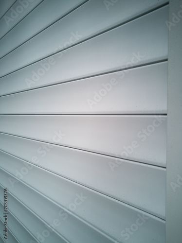 Beautiful view of the door closed with shutters. The view from the side