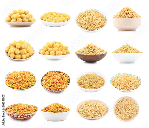 Indian Namkeen Food Collection Also know as Namkin, Nimco in Mixture namkeen, Aloo sev And Round Shaped Yellow Snack Also Know as puffs, puffy isolated on white Background