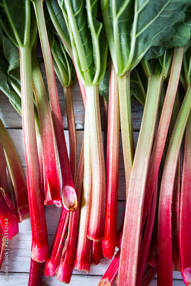 rhubarb stems on wooden surface