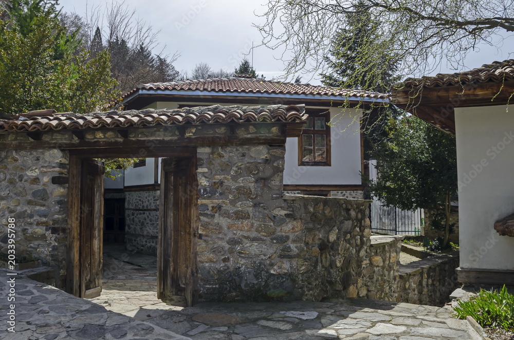 View toward main entrance in yard of antique house, residential district Varosha, Blagoevgrad, Bulgaria 