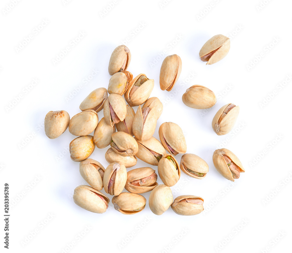 Pistachios isolated on white background, top view. Pistachios isolated on white background, top view.