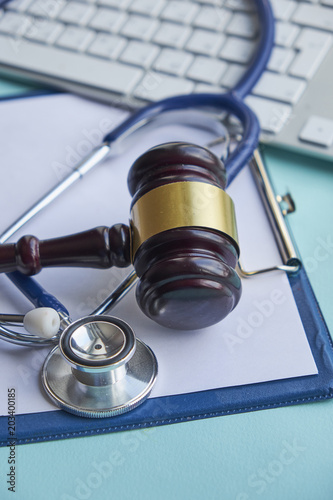 Gavel and stethoscope. medical jurisprudence. legal definition of medical malpractice. attorney. common errors doctors, nurses and hospitals make. photo