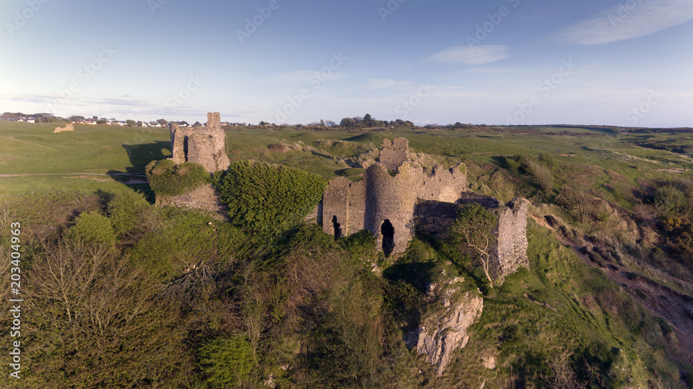 The ruins of Pennard castle on the Gower peninsula in Swansea, South Wales, UK, overlooking Three Cliffs Bay