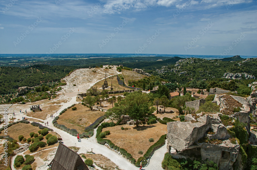 Panoramic view of the castle of Baux-de-Provence at the top of the hill, with the fields and hills of Provence just below. Bouches-du-Rhone department, Provence region, southeastern France
