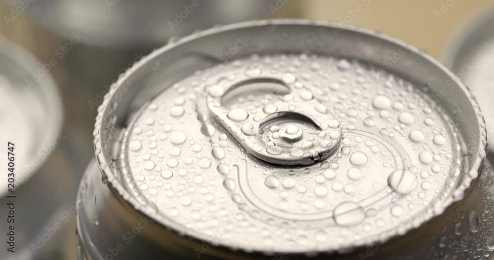 Water droplets on aluminum can of soda or beer in rotation Water droplets on aluminum can of soda or beer in rotation