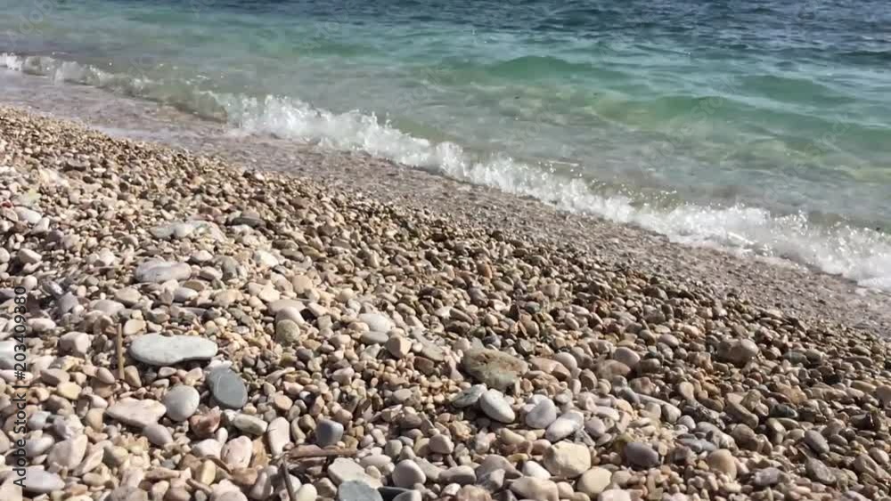 Adriatic sea surf. Sea waves runs on coastal pebble. Adriatic sea surf. Sea waves runs on coastal pebble.